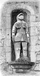 A pencil drawing of a stone statue of a knight
