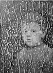 A pencil drawing of a boy looking at through a rain splattered window